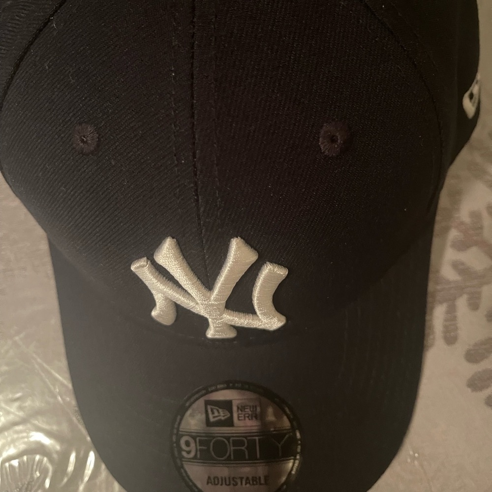 Selling a New York Yankee hat.